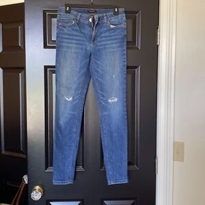 Like new. WHBM denim skimmer jeans with distressed holes